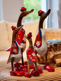 Duck Family in Red Costumes
