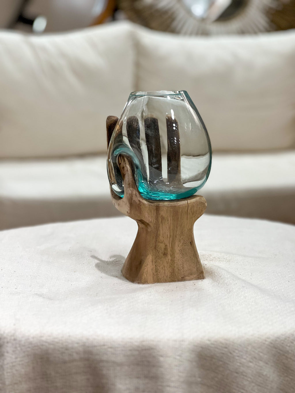 Glass hand with natural wood accent
