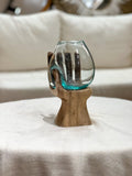 Glass hand with natural wood accent